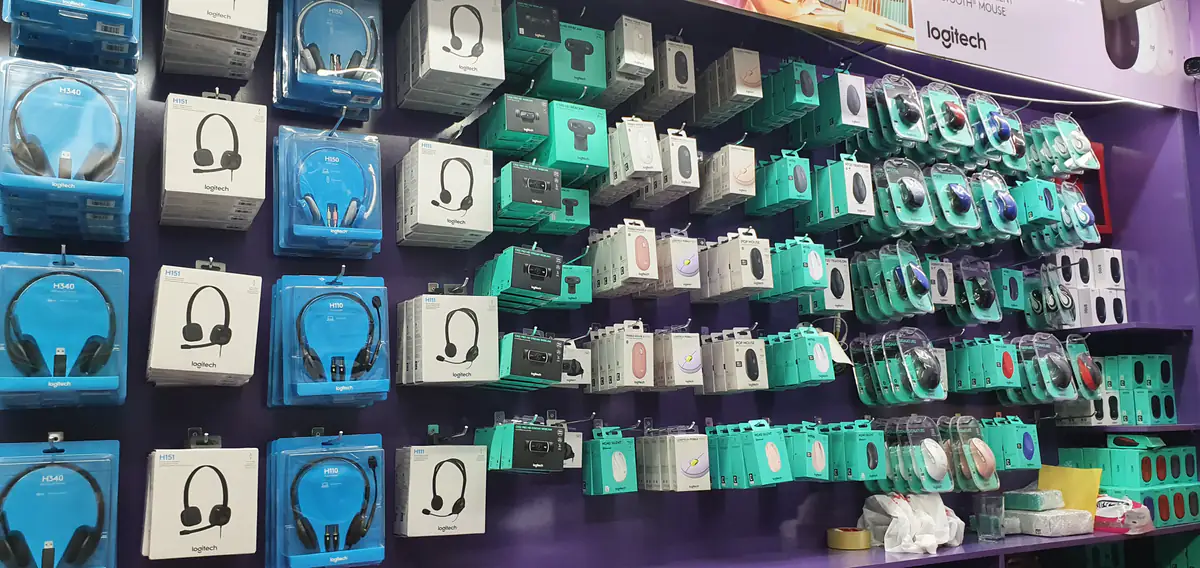 Logitech headsets, webcams and mice in sealed packaging on our stock wall