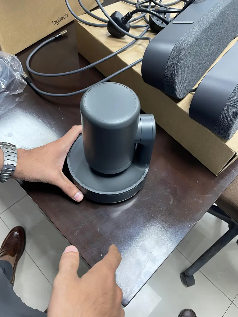 Logitech Rally camera and speakers being shown to a corporate client